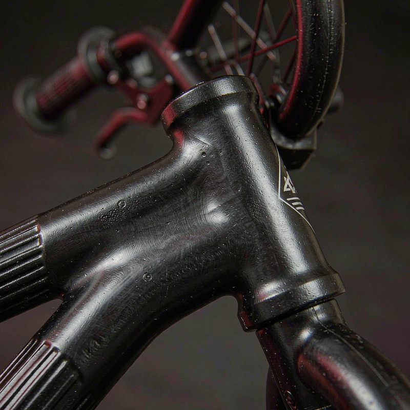Close-up of the RoyalBaby Astro magnesium alloy frame joint showing seamless cast construction