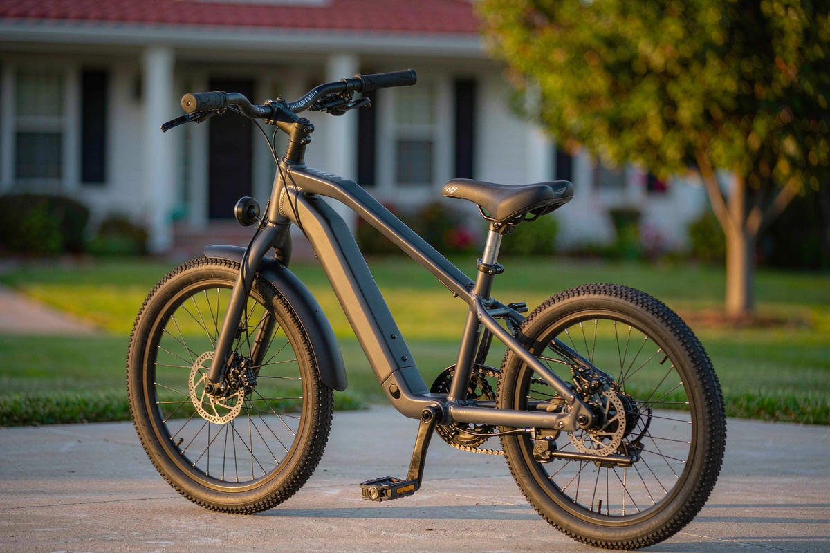 RoyalBaby Astro 16-inch magnesium kids bike parked on a suburban driveway