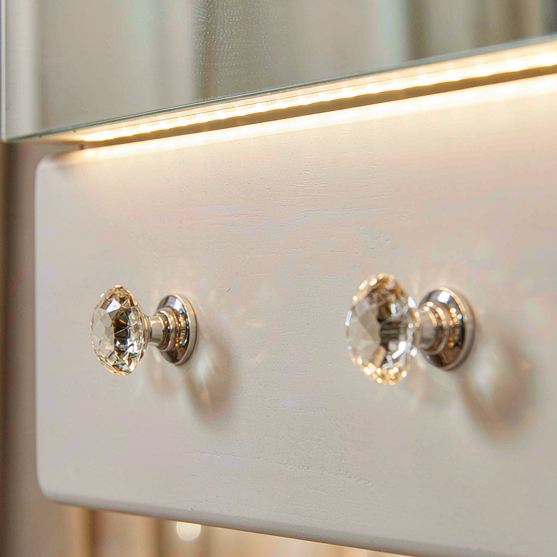 Close-up of the HNEBC vanity drawer with crystal knobs and lighted mirror