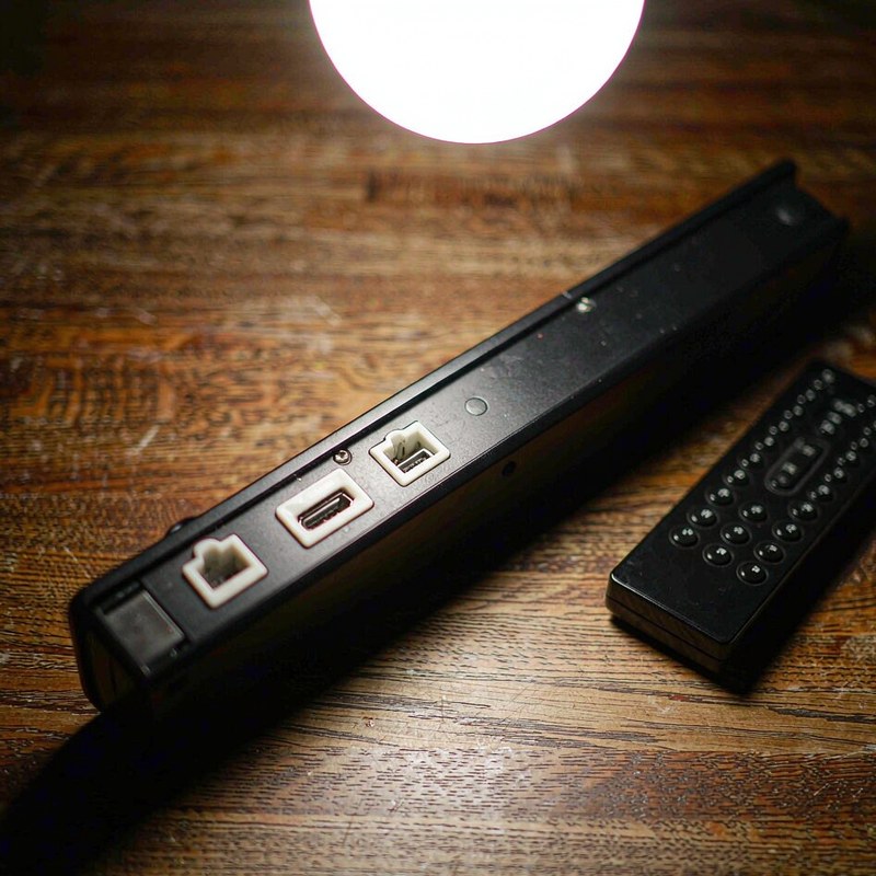HDMI ARC, optical and USB ports on the back of the soundbar with its remote.