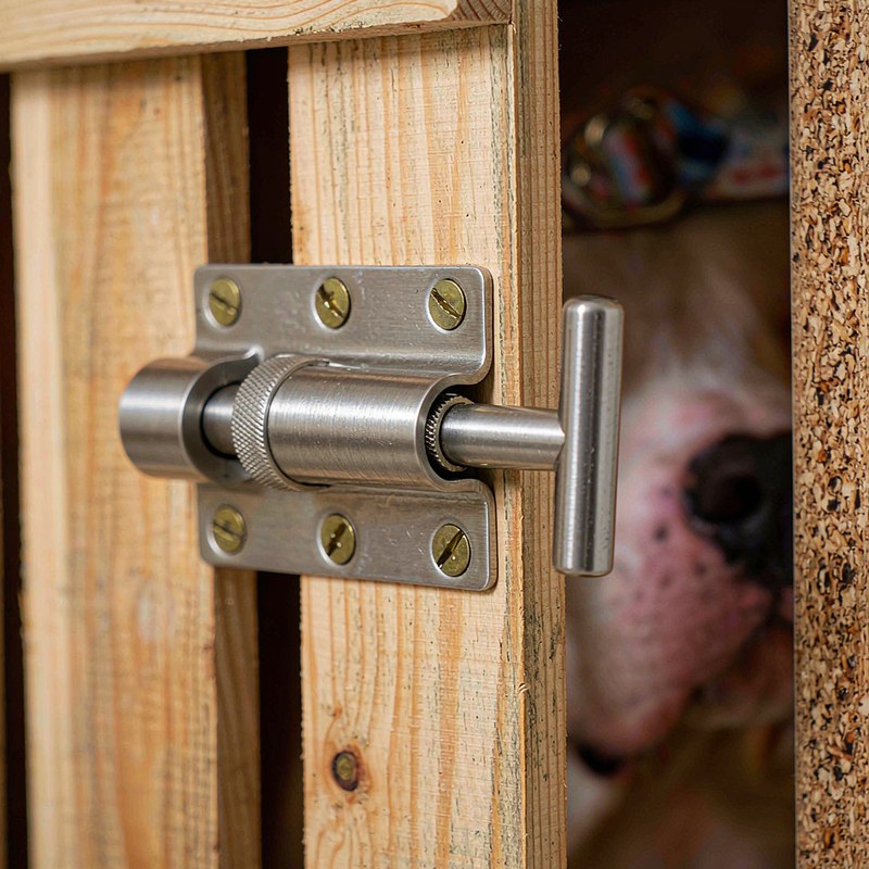 The brushed steel latch and melamine edge on the crate door.